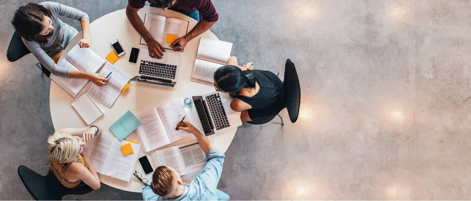 Stock Photo of Interns Working Together at a Table